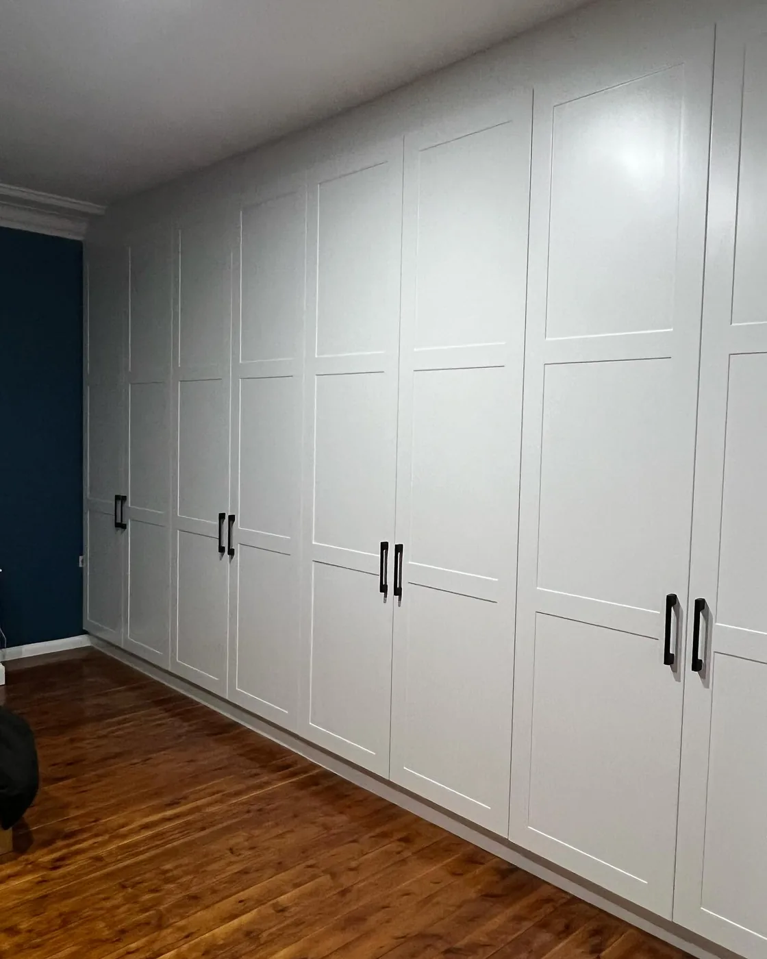 Full-wall custom built-in wardrobe by S & J Built In Wardrobes