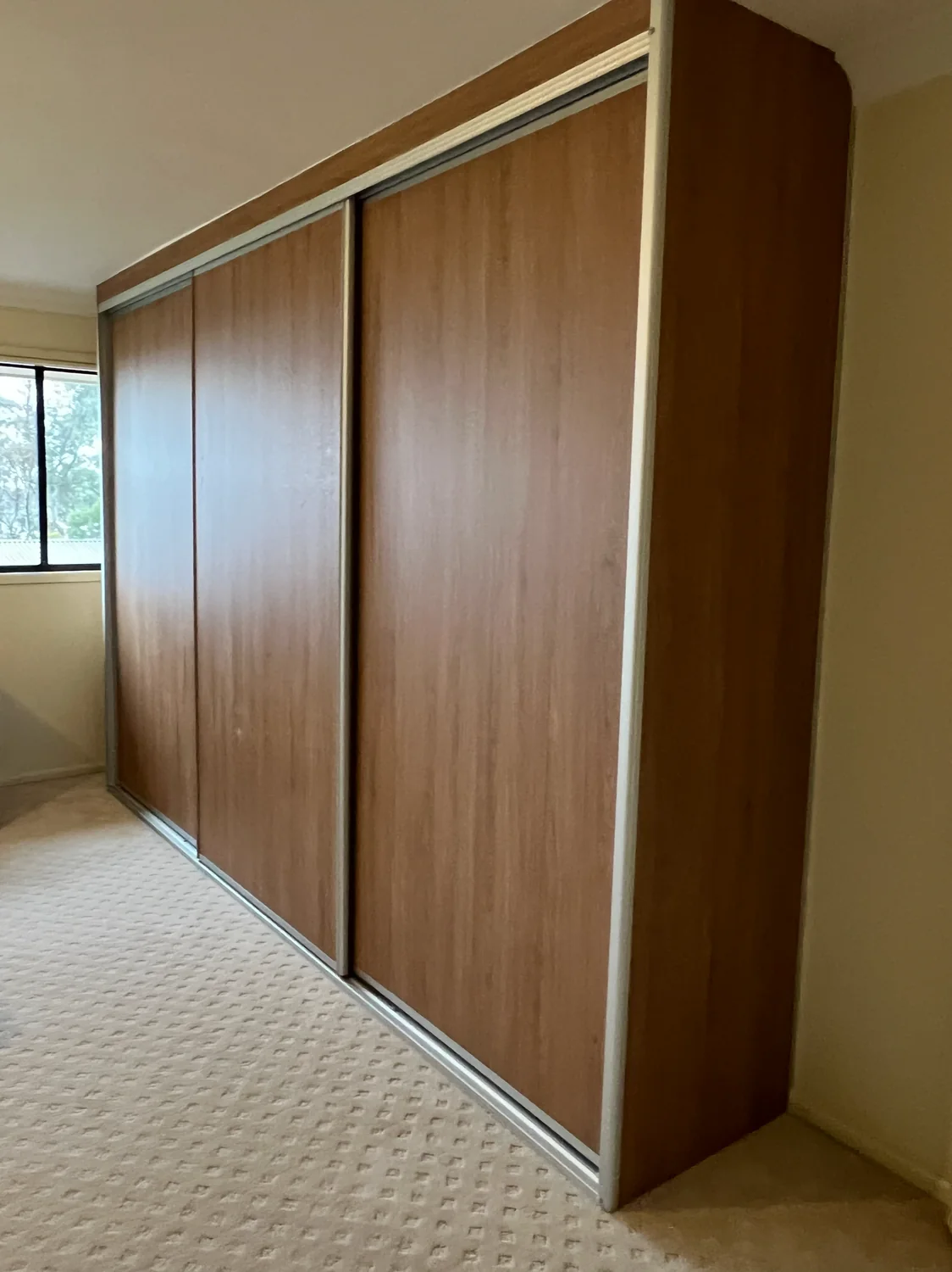 Woodgrain sliding door built-in wardrobe