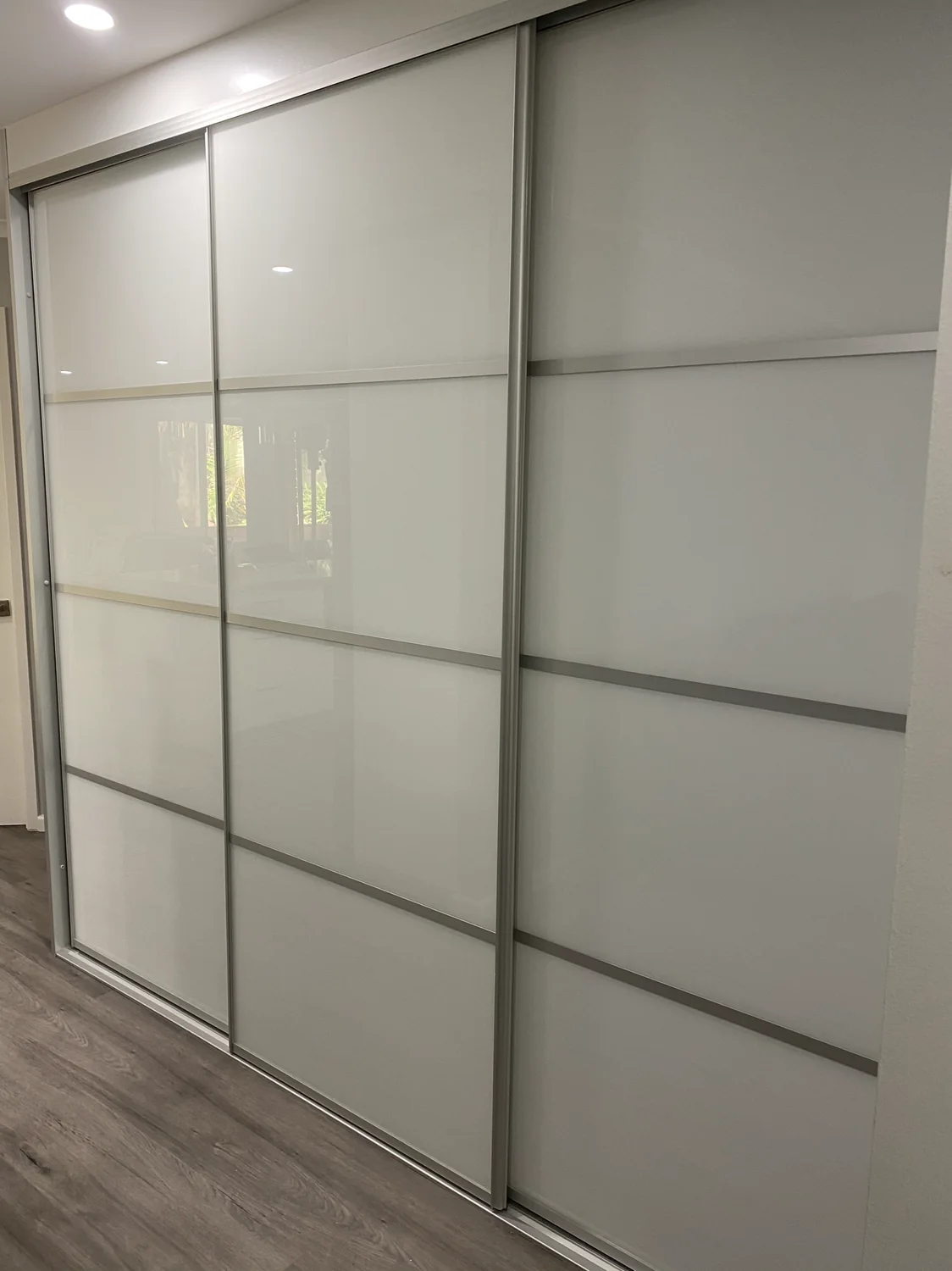 Frosted glass sliding doors with silver frames